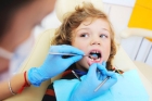 Удаление зуба у ребенка